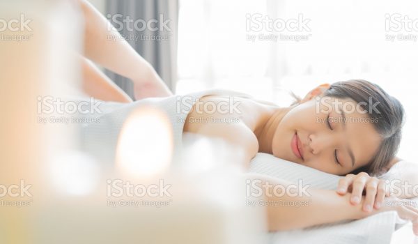 Young Asian woman  in spa salon getting massage.